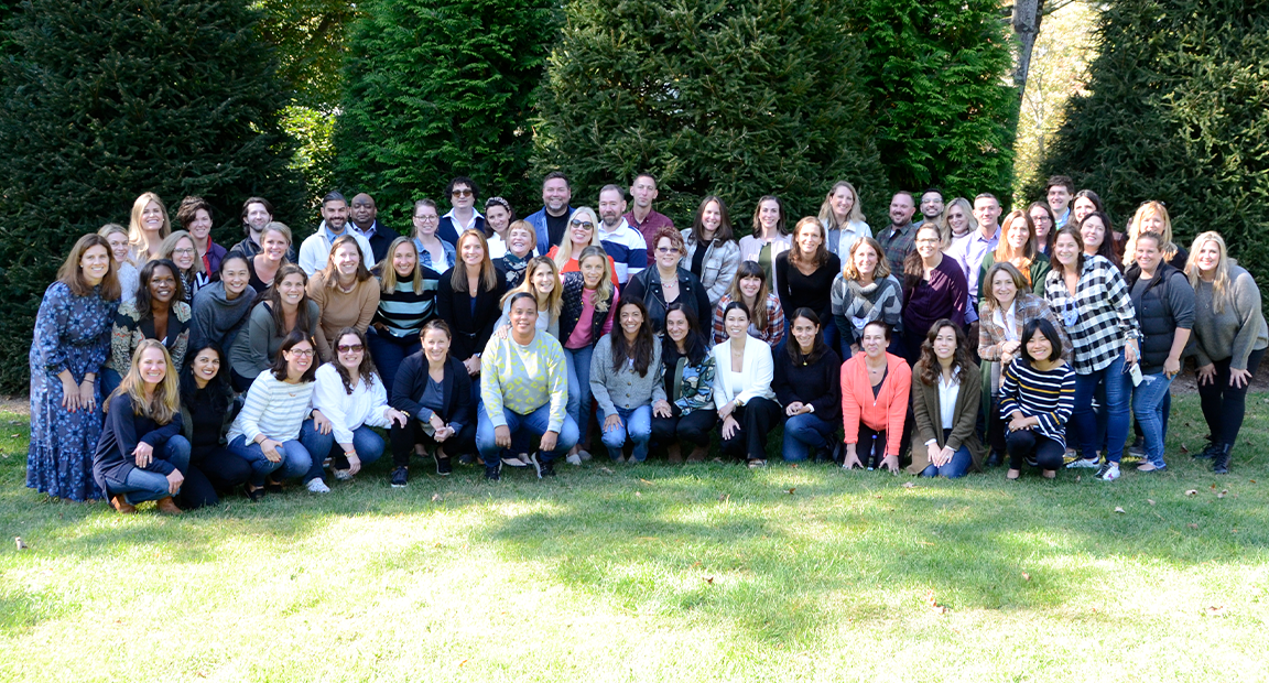 Group photo of GCI Health staff outdoors.