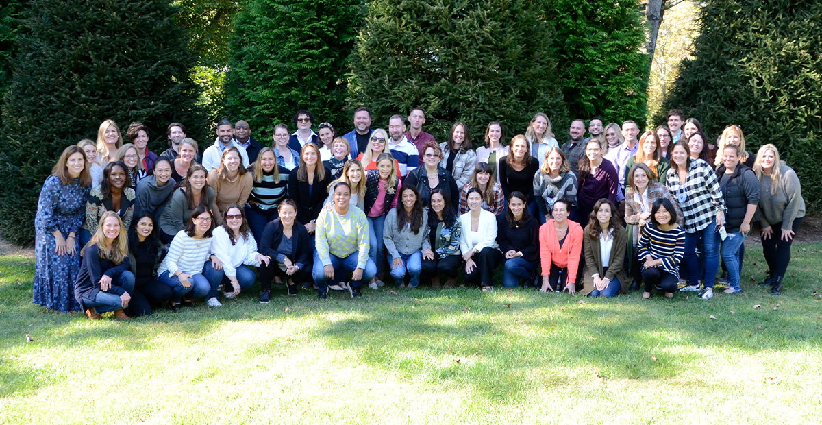 Group photo of GCI Health staff outdoors.