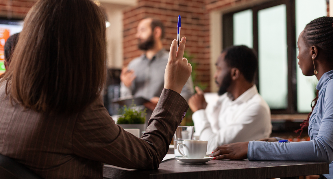 Diverse businesspeople attend a presentation.