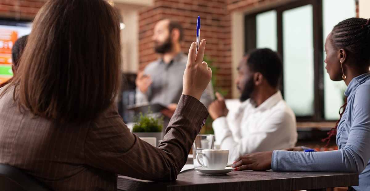 Diverse businesspeople attend a presentation.