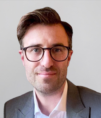Headshot of man in glasses