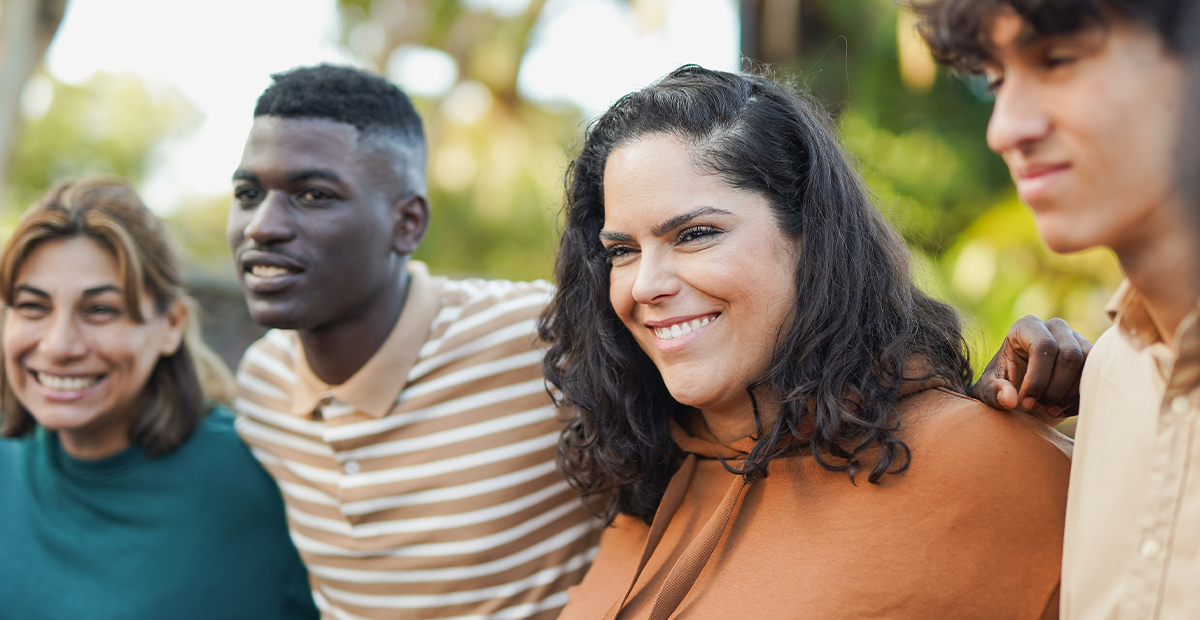 4 adult Hispanic and Black people smiling