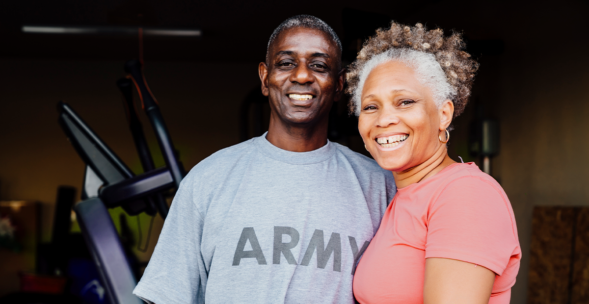 Photo of couple - man in Army shirt. Women in peach t shirt